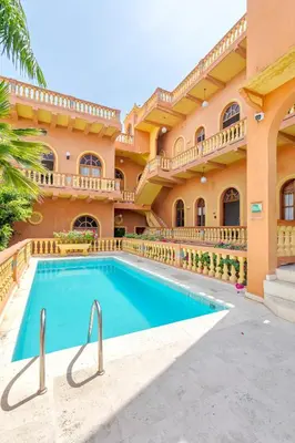 an exterior view of a large house with a swimming pool at Casa Morales Getsemaní in Cartagena de Indias