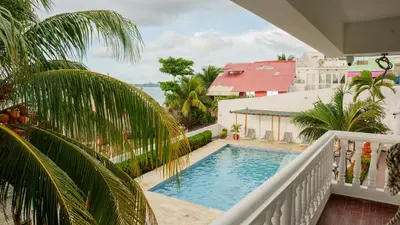 a view of a swimming pool from a balcony at hotel 3 banderas Manzanillo del Mar in Cartagena de Indias