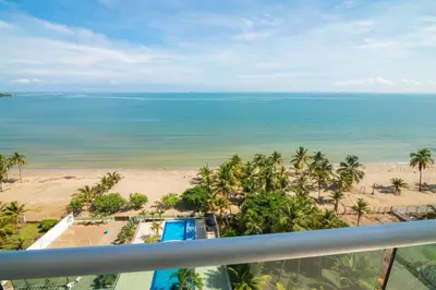 a view of the beach from the balcony of a resort at Magico Apartamento Frente al Mar 3 Habitaciones AR91 in Pativilca