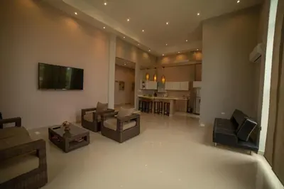a large living room with couches and a television at La Bonita Luxury Ecohotel in Sahagún