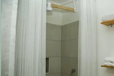a bathroom with a shower with a shower curtain at GREAT LOCATION ! 4 Bedroom Home in the Heart of Cartagena in Cartagena de Indias