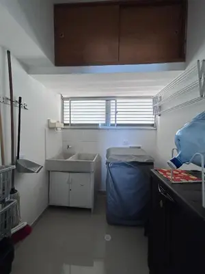a small kitchen with a sink and a window at Hermoso Apartamento Frente al Mar 2 Habitaciones PAZ148 in Coveñitas