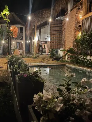a house with a swimming pool at night at älanacasadeplaya in San Bernardo del Viento