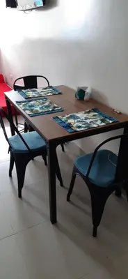 a wooden table with two chairs and a table and chairs sidx sidx sidx at Apto Nacaela-Bocagrande cerca a la playa in Cartagena de Indias