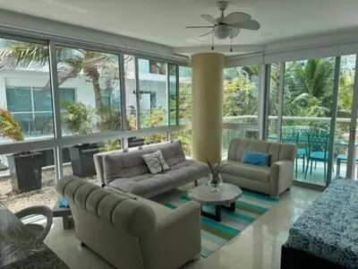 a living room with two couches and a table at Morros Vitri memorable in Cartagena de Indias