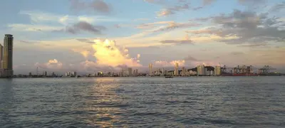 a view of a city from the water at sunset at apartaestudio al lado del mar in Cartagena de Indias