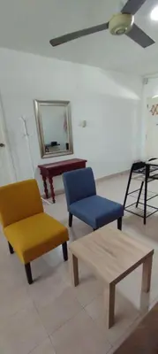 a room with chairs and a table and a mirror at apartaestudio al lado del mar in Cartagena de Indias