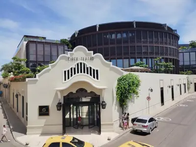 a white building on a street in front of a building at HOMEthel in Cartagena de Indias