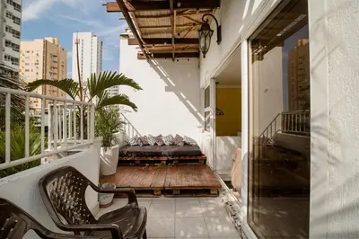 a balcony with chairs and a couch on a building at HOMEthel in Cartagena de Indias