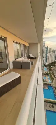 a balcony of a building with beds and a pool at H2 Hyatt Vista Mar!! in Cartagena de Indias
