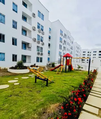 a playground in front of a large apartment building at Hermoso Apartamento en Coveñas en unidad residencial in Coveñas