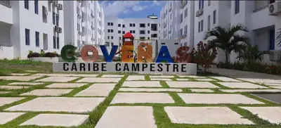 a sign for a carribean embassy in front of a building at Hermoso Apartamento en Coveñas en unidad residencial in Coveñas