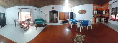 a living room with a table and chairs at Casa ITCI Tours in Cartagena de Indias