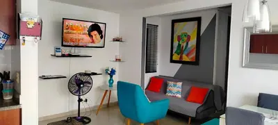 a living room with a couch and a chair at Apto cómodo, confortable para descansar y Disfrutar in Cartagena de Indias