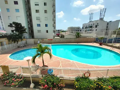 a large swimming pool in the middle of a building at Apto cómodo, confortable para descansar y Disfrutar in Cartagena de Indias