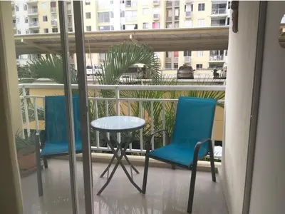 a balcony with two chairs and a table and a table at Apto cómodo, confortable para descansar y Disfrutar in Cartagena de Indias