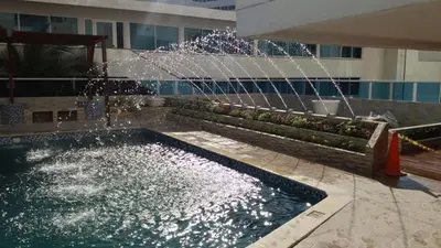 a water fountain in front of a building at Hermoso apartamento frente al Mar Caribe in Cartagena de Indias