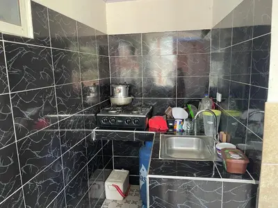 a small kitchen with a stove and a sink at sophia house in Cartagena de Indias