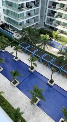 an overhead view of a pool with palm trees and buildings at MORROS ULTRA APTO 706 in Cartagena de Indias