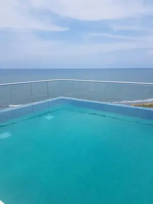 a swimming pool with a view of the ocean at Vista mar!! in Cartagena de Indias
