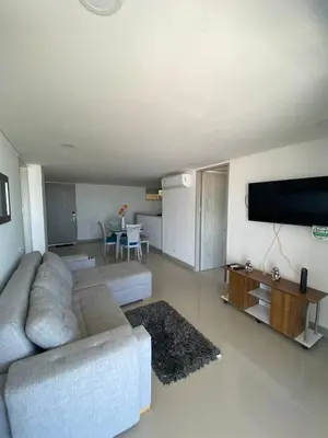 a living room with a couch and a flat screen tv at Vista mar!! in Cartagena de Indias