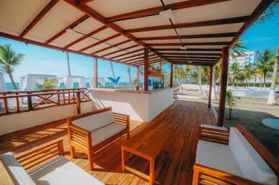a balcony with a view of the beach and the ocean at Kpré Coveñas by Bernalo Hotels in Coveñas