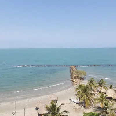 an aerial view of a beach with palm trees and the ocean at Magico Apartamento Frente al Mar 3 Habitaciones FB73 in Coveñas