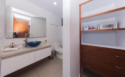 a bathroom with a sink and a toilet and a mirror at Palmetto frente al mar 2603 in Cartagena de Indias