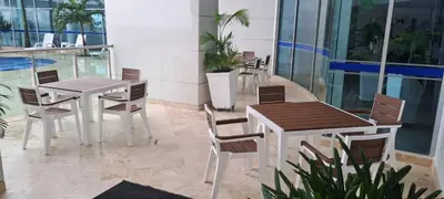 a restaurant with tables and chairs in a building at Palmetto frente al mar 2603 in Cartagena de Indias