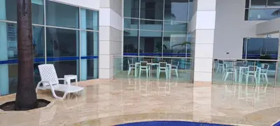a building with chairs and tables in a courtyard at Palmetto frente al mar 2603 in Cartagena de Indias