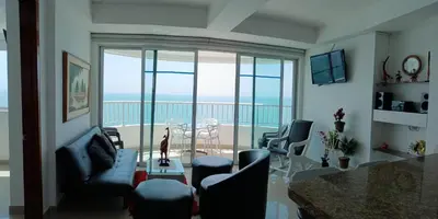 a living room with a view of the ocean at Palmetto frente al mar 2603 in Cartagena de Indias