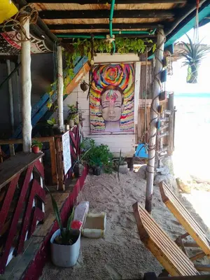a house with a painting of a face on the wall at DespertArte espacio de Arte y Hospedaje in Playa Blanca