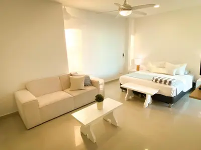 a living room with a bed and a couch at Vista al mar en Cartagena , Apartamento en Morros in Cartagena de Indias