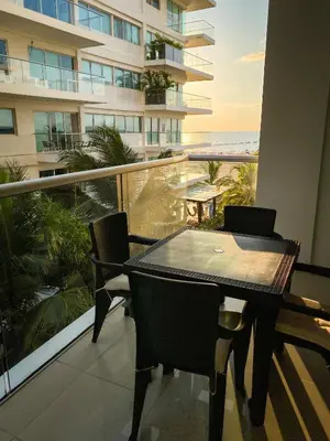 a table and chairs on a balcony with a view of the ocean at Vista al mar en Cartagena , Apartamento en Morros in Cartagena de Indias