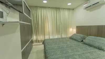 a small bedroom with a bed and a window at APARTAMENTO MARINARE DE 2 HABITACIONES CON SALIDA DIRECTA A LA PLAYA in Cartagena de Indias