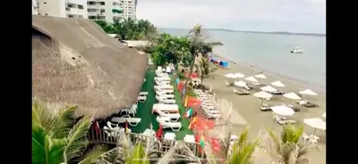 a group of boats parked on a beach at PLAYA LAGUITO in Cartagena de Indias