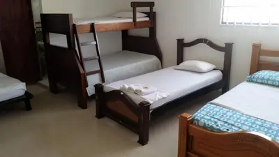 a room with three bunk beds in a room at hotel interamericano in Barranquilla