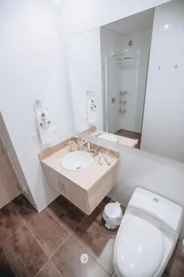 a bathroom with a sink and a toilet and a mirror at Deluxe Spectacular Sunset in Santa Marta