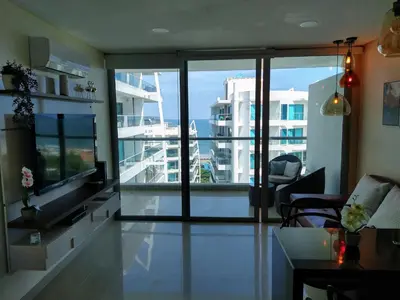 a living room with a view of a building at Paraíso en Cartagena Confort Privado con Amenidades de Hotel in Cartagena de Indias