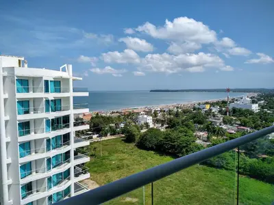 a view of the beach from the balcony of a building at Paraíso en Cartagena Confort Privado con Amenidades de Hotel in Cartagena de Indias