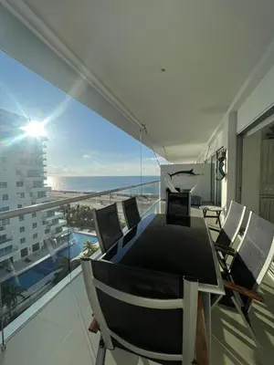 a dining room with a view of the ocean at Edificio Morros Epic Lujo con Panorama in Cartagena de Indias