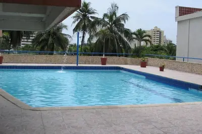 a large swimming pool with a water fountain at Cartagena de Indias, Mar, historia y diversión ! in Cartagena de Indias