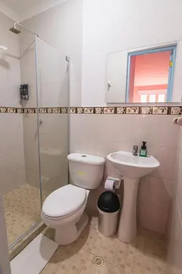 a bathroom with a toilet and a sink at San Felicin Hostel in Cartagena de Indias
