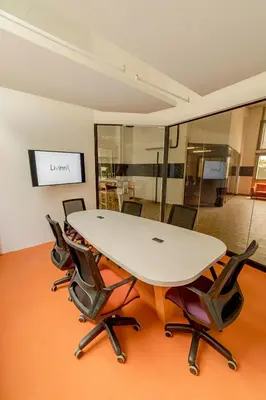 a conference room with a table and chairs at LivinnX Barranquilla in Barranquilla