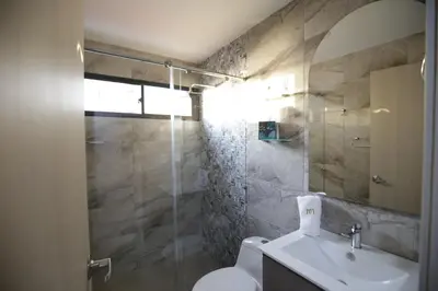 a bathroom with a toilet and a sink and a shower at Apartamento Edificio Portofino 701 in Cartagena de Indias