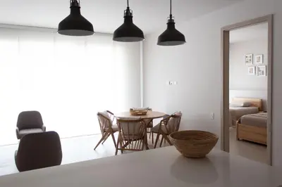 a room with a table and chairs and a bedroom at Serena del Mar, Morros IO in Cartagena de Indias