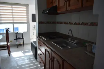 a kitchen with a sink and a counter top at Apartamento en Cartagena Edificio El conquistador Sector el Laguito - By Corfeinco in Cartagena de Indias
