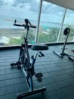a bike in a room with a view of the ocean at Playa Cartagena Apartments in Cartagena de Indias