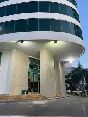 a large building with a sign on the side of it at Playa Cartagena Apartments in Cartagena de Indias