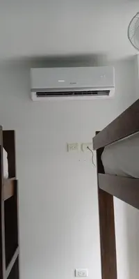 a bedroom with a ceiling fan and a bed at Casa de Playa frente al mar. in Coveñas